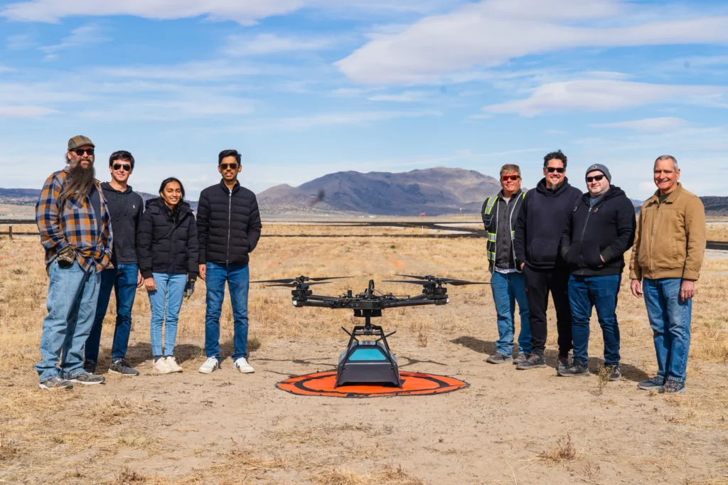Aerobotics7 team and the EAGLE A7 drone platform at a testing site in Reno, Nevada.